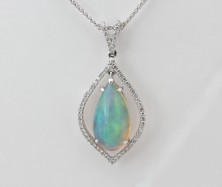 18KW NATURAL ETHIOPIAN OPAL AND DIAMOND PENDANT ON A 16 INCH CHAIN