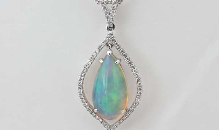 18KW NATURAL ETHIOPIAN OPAL AND DIAMOND PENDANT ON A 16 INCH CHAIN
